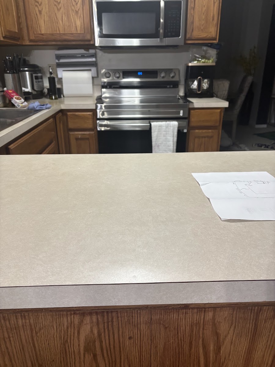 Kitchen before renovation, dated laminate countertop